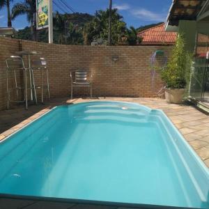 Bazén v ubytování Pousada das Pedras nebo v jeho okolí