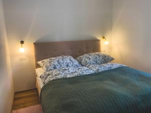 a bedroom with a bed with two pillows on it at Palais Carducci in Bolzano