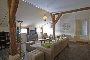 a living room with a couch and a table at Posthoorn Lodge in Woerden