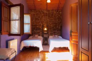 En eller flere senge i et værelse på Casa La Pumarada de Villaviciosa