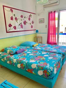 Postel nebo postele na pokoji v ubytování Hotel De la Plage