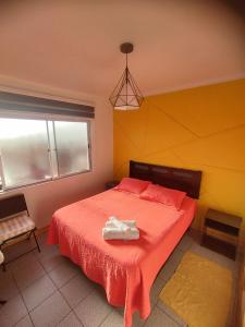 Aji Verde Hostel tesisinde bir odada yatak veya yataklar