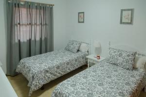 Postel nebo postele na pokoji v ubytování Casa Ramón Acosta