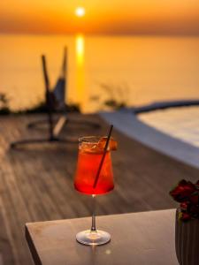 a drink in a glass sitting on a table at SECRET HILL in Athani