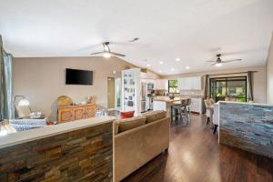 a kitchen and living room with a couch and a table at Cozy home in Gulf Gate in Sarasota