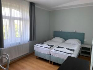 Postel nebo postele na pokoji v ubytování Pod Jabłonią