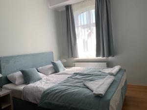 Postel nebo postele na pokoji v ubytování Pod Jabłonią