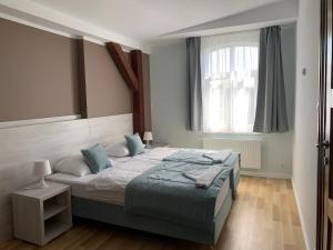 Postel nebo postele na pokoji v ubytování Pod Jabłonią