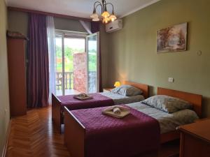 En eller flere senger på et rom på Apartments Šeherzada