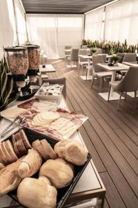 a room with a table with bread and other foods at Relais Manzoni in Rome