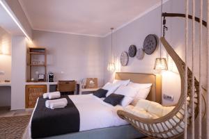 Postel nebo postele na pokoji v ubytování Glykeria Mini Suites
