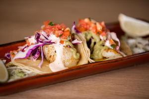 a plate of food with tacos and salsa at Gold Country Casino Resort in Oroville