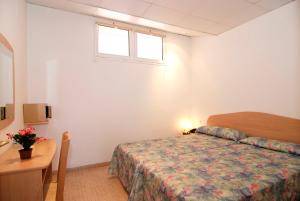 Postel nebo postele na pokoji v ubytování Hotel Port-Bo