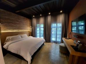 Postel nebo postele na pokoji v ubytování The Art Hotel Medellin