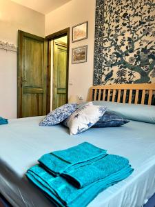 En eller flere senger på et rom på Villa Antonella