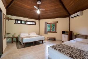 Postel nebo postele na pokoji v ubytování Canto d Alvorada Hotel Pousada + 37 fotografií