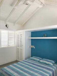Ένα ή περισσότερα κρεβάτια σε δωμάτιο στο Caribbean Villa Los Lobos Ballenas Beach