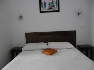 Postel nebo postele na pokoji v ubytování Hôtel Central