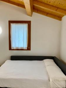 Llit o llits en una habitació de Casa Al Piazzol