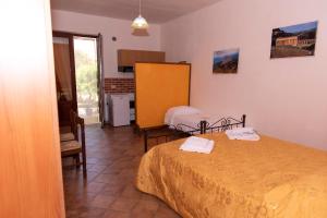 Ένα ή περισσότερα κρεβάτια σε δωμάτιο στο Baglio Mustazza