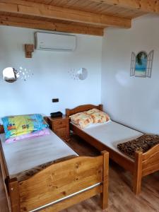 Postel nebo postele na pokoji v ubytování Ośrodek Wypoczynkowy Hacjenda