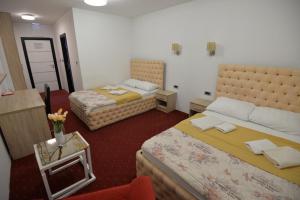 En eller flere senge i et værelse på Prenoćište Bis
