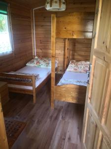 Postel nebo postele na pokoji v ubytování Ośrodek Wypoczynkowy Hacjenda