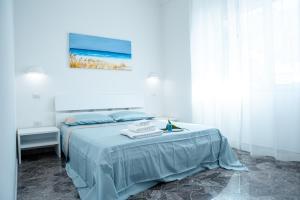 Postel nebo postele na pokoji v ubytování Torre del Salento