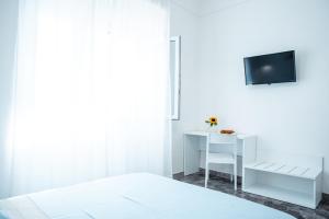 Posteľ alebo postele v izbe v ubytovaní Torre del Salento