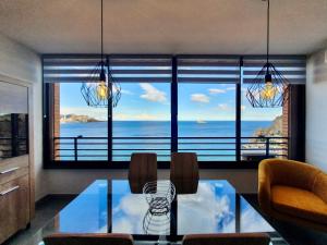a dining room with a view of the ocean at Playa Poniente Benidorm in Benidorm