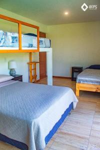 a bedroom with two bunk beds in a room at HOP OHANA exclusiva en campo y playa en Chincha in Chincha Baja +37 photos