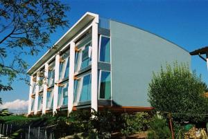 a large house with large windows on the side of it at Antares Apartments in Preganziol