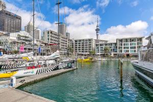 a group of boats docked at a marina in a city at Penthouse Glory in Auckland
