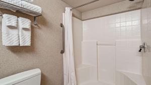 a bathroom with a shower and a toilet at Best Western Plus North Las Vegas Inn & Suites in Las Vegas