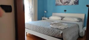 En eller flere senge i et værelse på Villetta Marina Verde Cinquale
