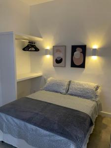 Кровать или кровати в номере Hotel Petit Village Icaraí +56 фотографий
