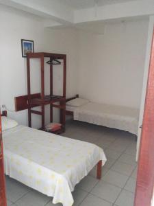 Postel nebo postele na pokoji v ubytování Hotel Pousada Hamburgo
