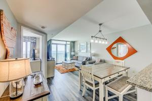 a kitchen and living room with a table and chairs at Caribbean Resort and Villas 1107 in Myrtle Beach