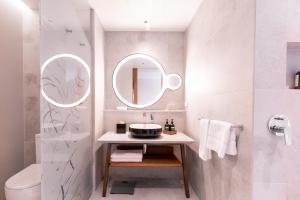 a bathroom with a sink and a mirror at Crowne Plaza Hobart, an IHG Hotel in Hobart