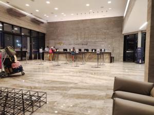 a lobby of a shopping center with people in it at Salinas Premium Resort in Salinópolis