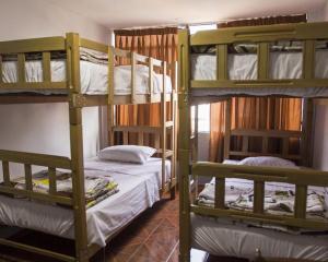 a room with two bunk beds in a hostel at Hostal Las Fresas Lima Airport in Lima