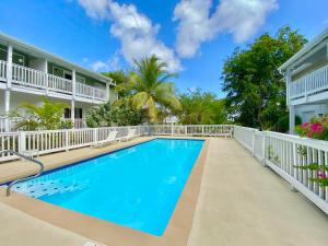 a swimming pool in front of a building at Breezy Nights St. Croix in Christiansted