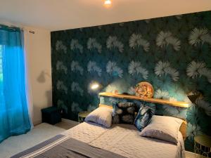 Voodi või voodid majutusasutuse Kartier chambre deluxe toas