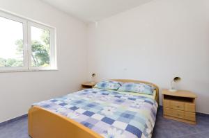 Posteľ alebo postele v izbe v ubytovaní Apartments Ruzica M