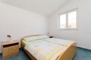 מיטה או מיטות בחדר ב-Apartments Ruzica M
