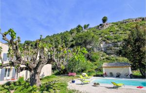 a villa with a swimming pool and a mountain at Gorgeous Home In Merindol in Mérindol +15 photos