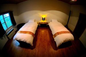 HA-MON Slope Side Hotel and Private Chalet客房内的一张或多张床位