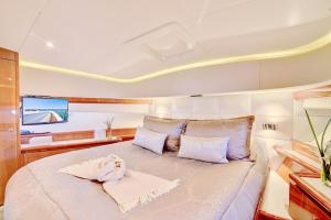 a large bed in the middle of a boat at Luxurious 3 bedroom yacht Also offers charters in Miami Beach