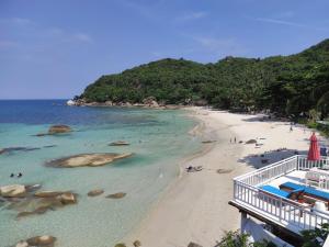 a view of a beach with people in the water at Crystal Bay Beach Resort in Lamai