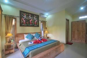 Letto o letti in una camera di The Suci Sari Ubud